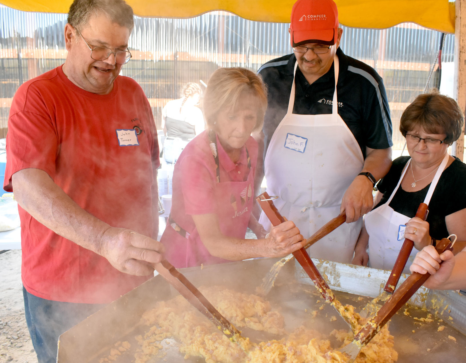 Volunteers cook a mountain of eggs
